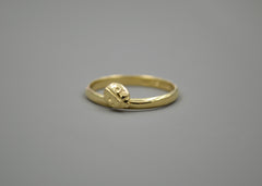 14k Gold Band with a ladybug sitting on it