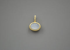 Oval Moonstone set in a textured yellow gold bezel pendant with stars carved into the sides. Front view so you're only seeing the textured bezel and moonstone.